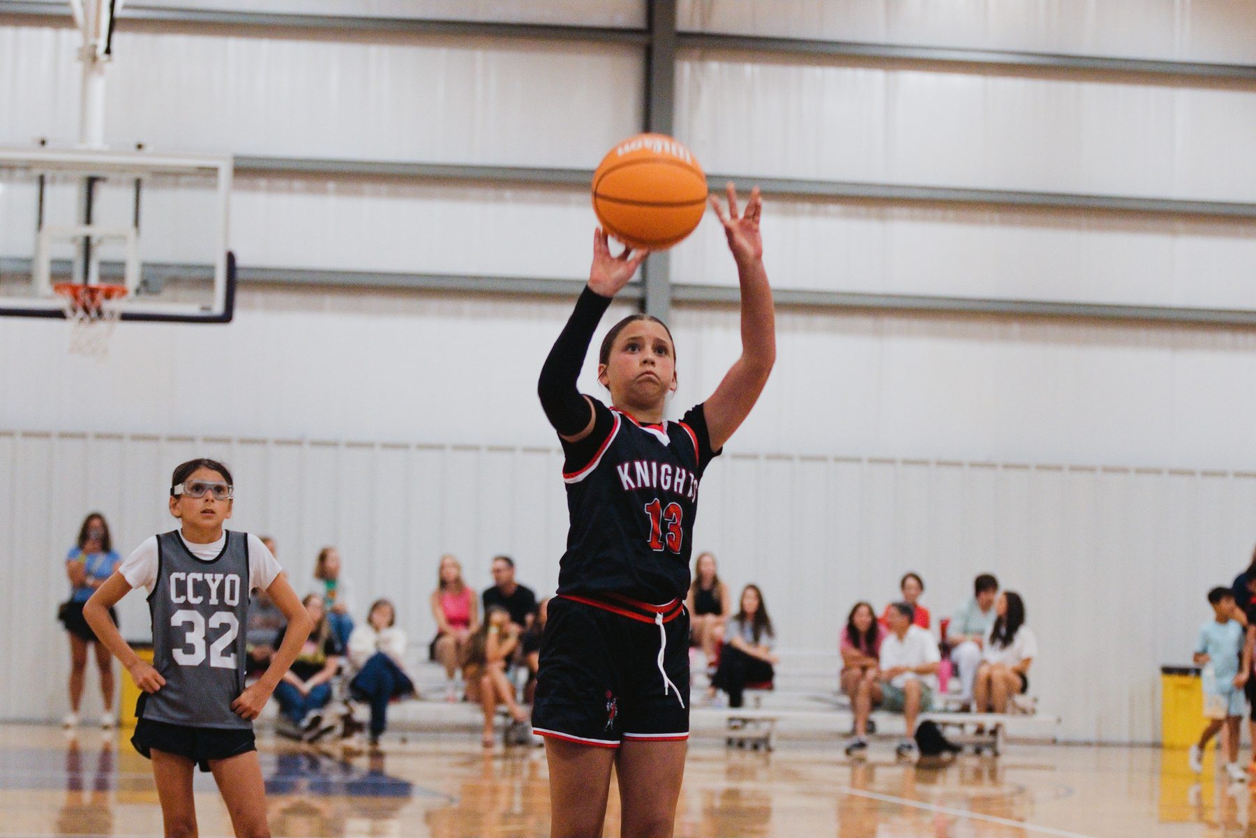 Basketball player at the free throw line, eyes on the rim