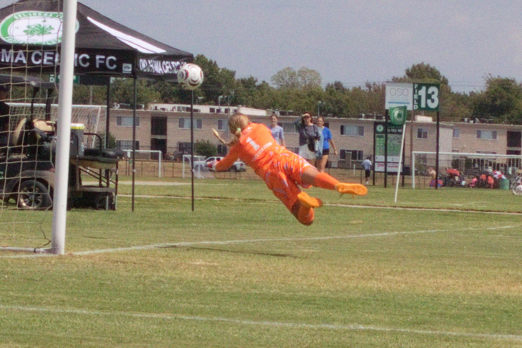 Goalkeeper diving full stretch for a save